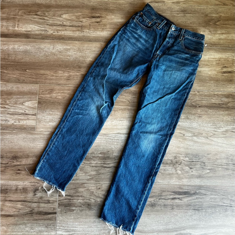 Levi’s button fly 501s with leather tag distressed fray and ankle hem. 27-32